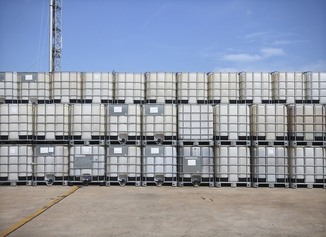 Stack of IBCs chemical storage tanks