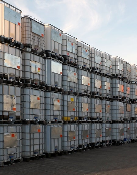 Stacked IBC totes on pallets 