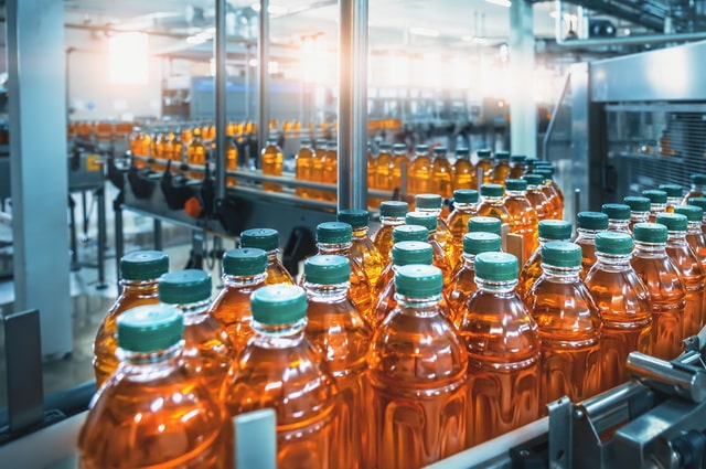 Juice Bottles in a Factory Production 