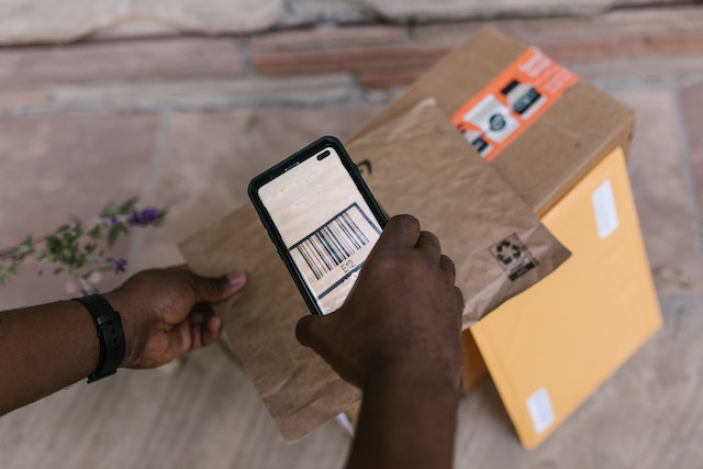 Person scanning a barcode on a package