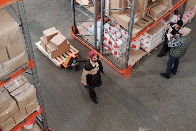 Warehouse workers moving boxes in a warehouse