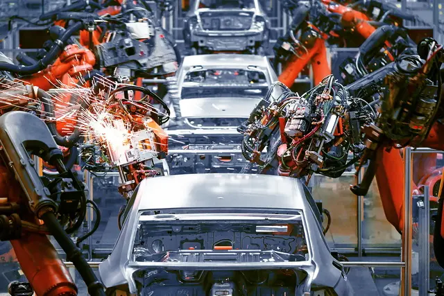Robots welding on a car production line