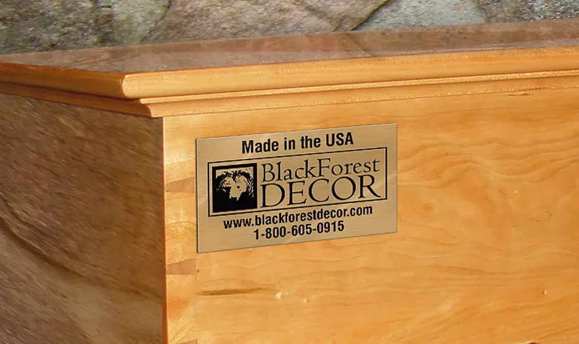 A brass nameplate with a company name & logo